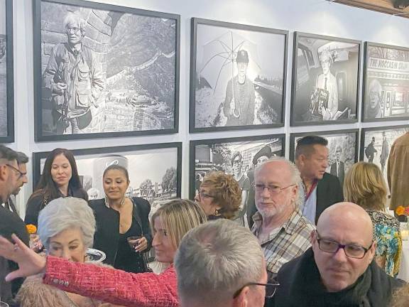 The guests with Christopher Makos’ Portraits in the background.