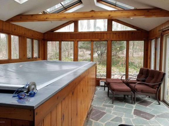 A stone-front colonial nestled in the woods A stone-front colonial nestled in the woods