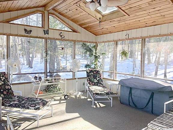 Custom three-bedroom contemporary lakefront with private dock Sunroom