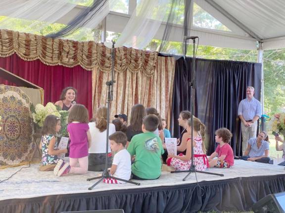 Emily Margevich with children from the audience singing “My Favorite Things/ Do Re Mi,” from “The Sound of Music,” by Richard Rogers