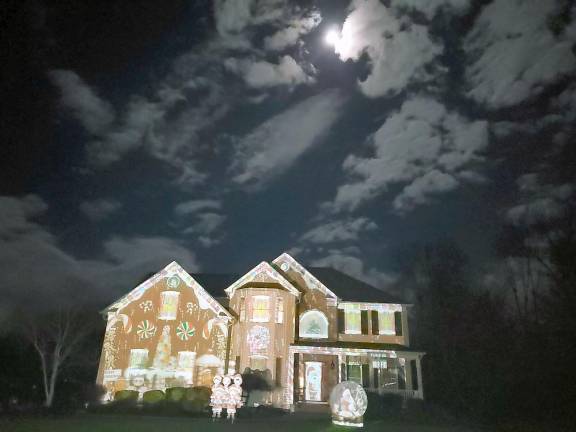 Sparta family turns home into drive-by holiday phantasmagoria Through high tech projection art, a changing compilation of videos, pictures and gifs tell a story on the Galluccio family’s house. (Photo provided by Elaine Galluccio)