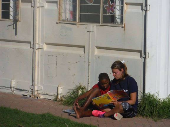 Lending a loving hand in South Africa Mary Bocskocsky tutors a child at South Africa’s Ikalthemba children’s shelter (Photo provided)
