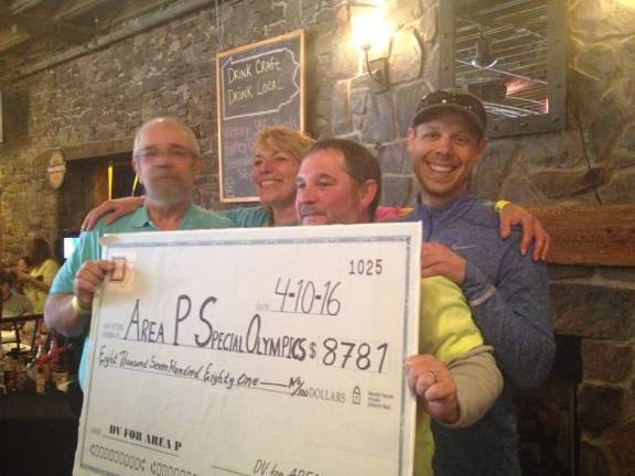 Half-marathon runners raise $12K for Special Olympics Joe from Special Olympics, Maria Farrell, Robert Skibber, and John Staub (Photo provided)