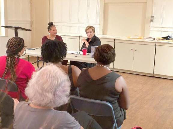 Milford Readers and Writers Festival times five Christa Caceres, president of the Monroe County NAACP Chapter (left) and author Paula Giddings talk about Giddings’ book Ida B. Wells and the Campaign against Lynching.
