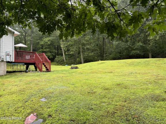 Enjoy comfort and relaxation on 1+ acres in a natural setting Enjoy comfort and relaxation on 1+ acres in a natural setting