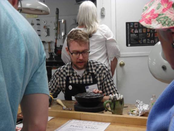 Locals get crafty Noah Quinn, Fellow of Fine Metals demonstrates fine metal working.