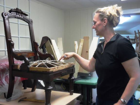 A match made in heaven: Shohola neighbors open custom upholstery shop in Milford Debi DeGiorgis points to the eight-way hand-tied springs that customers in the know look for. (Photo by Anya Tikka)