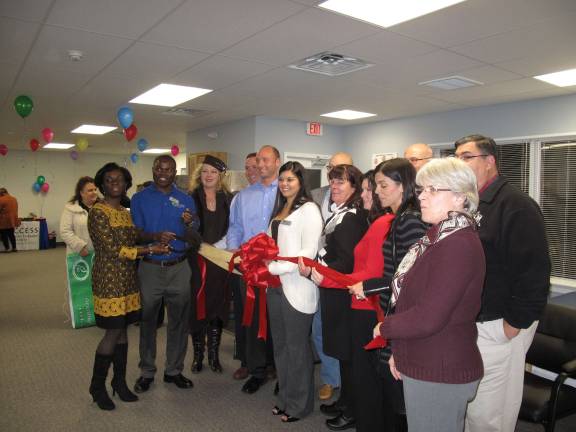 Access Physical Therapy celebrates opening of second PA location Staff and owners get ready to cut the ribbon on their new facility
