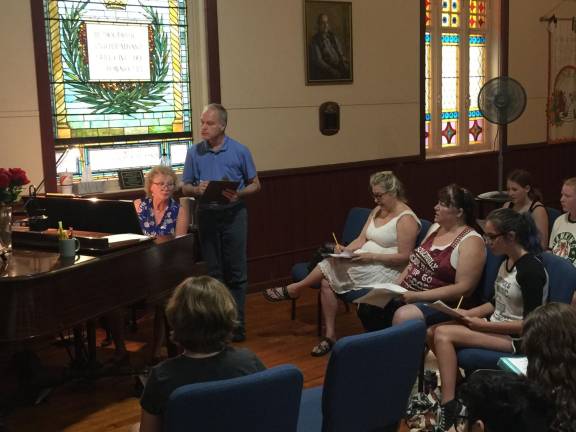 Musical director Sandy Stalter at the piano during rehearsals, with director Jeffrey Stocker