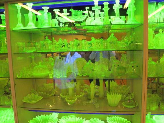 Vaseline glass is a little-known treasure Vaseline glass being displayed in his many blacklighted show cases at the Hawley Antique Exchange. There are 22 blacklighted display cases seven feet high by four feet wide in the lower level of the building.