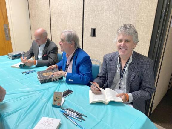 Milford Readers and Writers Festival times five Left to right, authors Richard Morais, Paul Freedman and cartoonist Bob Eckstein talk to fans as they sign their books.