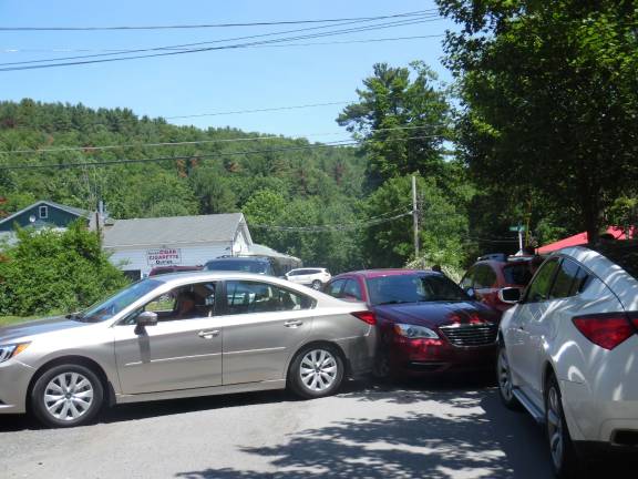 Terror at the farmers market The red car in the center turned, hit the vehicle to the right, ran up the neighboring property's lawn, and eventually headed toward the market (Photo by Anya Tikka)