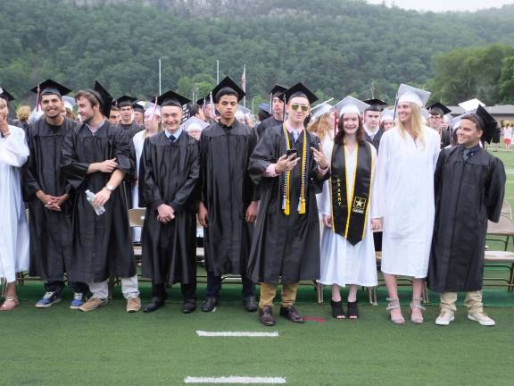 Delaware Valley High School graduate Jonathan Ayala wears cool shades as he hangs out with his fellow graduates.