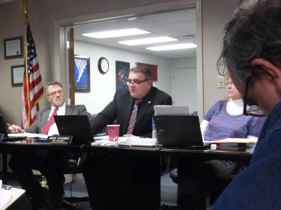 Vice President Jack O&#x2019;Leary (center) questions Superintendent John Bell about his pole barn idea. On the left is Brian Carso, and on the right President Pam Lufty. (Photo by Anya Tikka)