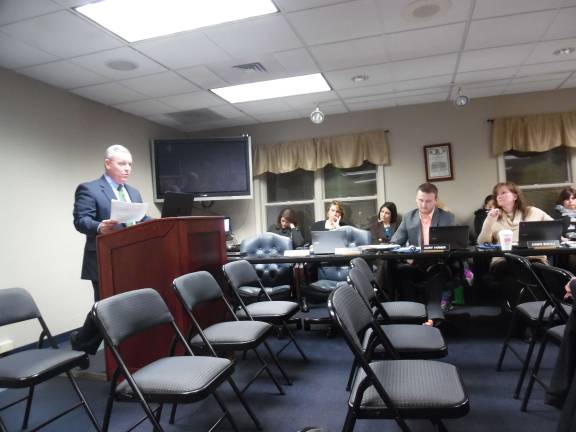 Pay now or pay more later on school barn, superintendent says Superintendent John Bell addresses the board (board members Cory Homer and Dawn Bukaj are pictured) (Photo by Anyaa Tikka)