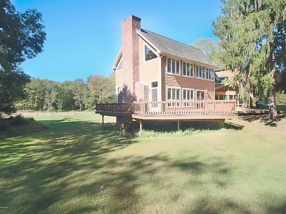 Mountaintop equestrian estate includes modern home and pond Exterior