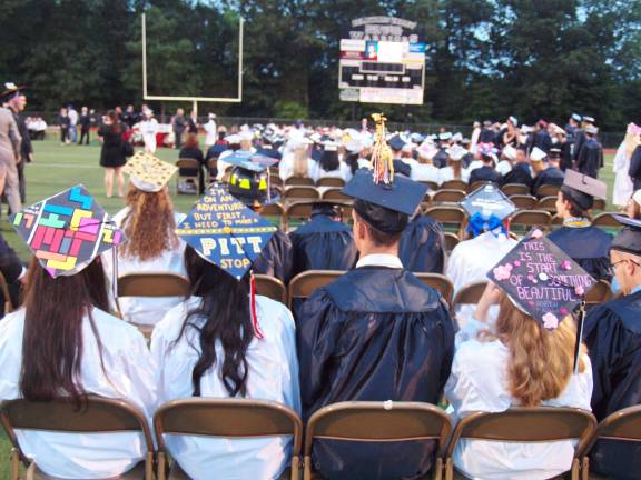 Graduates use their caps to display their artistic side