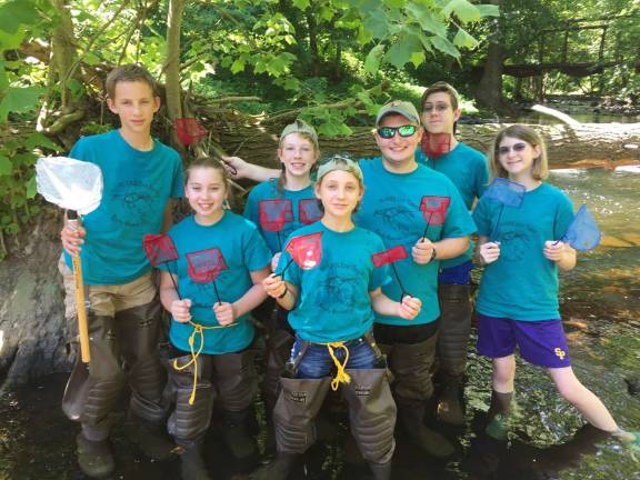 Wallenpaupack students scour riverbank for feisty species of crayfish Students from Wallenpaupack Area High School prepare to survey for crayfish in Raymondskill Creek in Delaware Water Gap National Recreation Area. Students, left to right, are: Max Olsson, Jillian Tait, Paulina Schmidt, Marlee Olsson, Robbie Opalecky, Charles Olsson, and Ann Olsson. photo PROVIDED