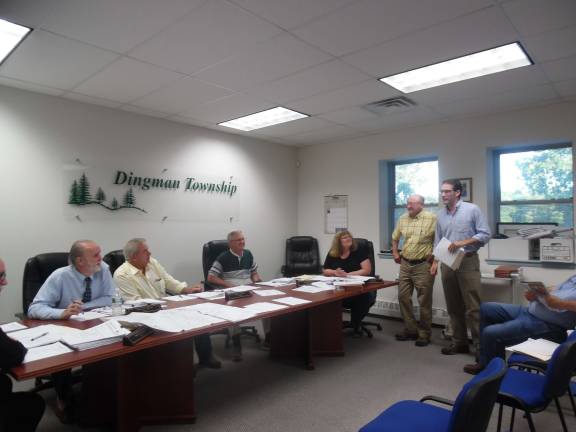 Day care center, conservation area, get first nod Dingman Supervisors talk with Kyle Shenk (far right), representing the Conservation Fund, and Frank Smith, surveyor. (Photo by Anya Tikka)