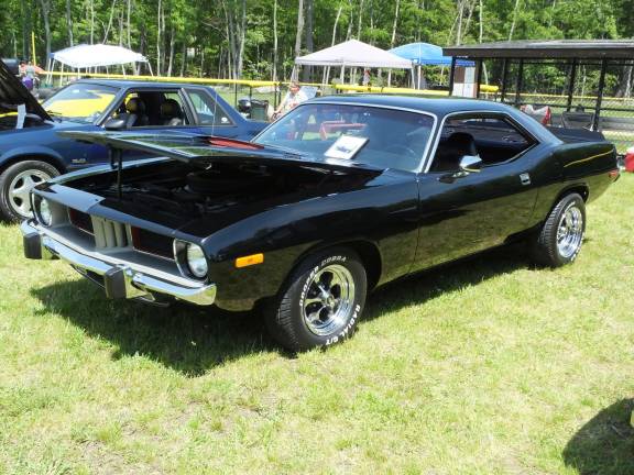 The cars are the stars at 'Cruise in the Park' A polished 1973 Plymouth Barracuda with a 340 six pack owned by Colin and Amy Burke of Pike County