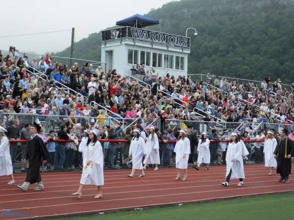 The Class of 2017 walks past the stands