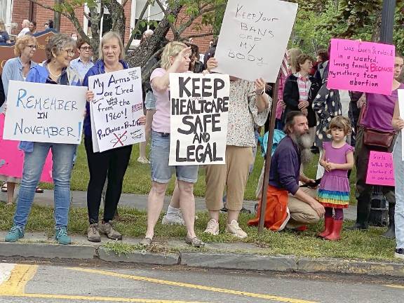 Demonstrators of all ages held up handmade signs.