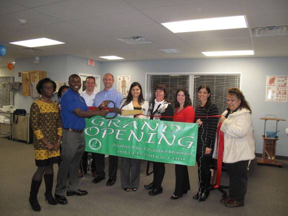 Access Physical Therapy celebrates opening of second PA location Staff and owners get ready to cut the ribbon on their new facility