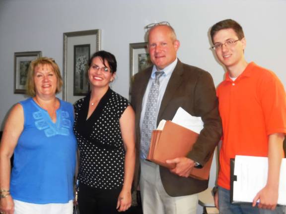 Day care center, conservation area, get first nod Representing Good Shepherd Child Care Center are (from left): Beth Jones; Angela Smith; Eric Hamill, attorney; and Ben Barland of Kiley Associates, the project engineer. (Photo by Anya Tikka)