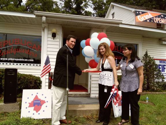 'True-hearted patriots' gather at new GOP headquarters Rep. Mike Peifer, Lynn Homer and Tammy Gillette cut the ribbon on the new Pike County Republican headquarters. (Photos by Charlie Reynolds)