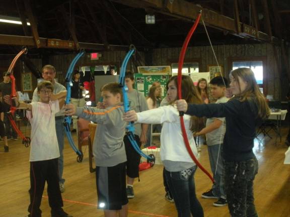 Fall fun at Harvest Festival Photo by Mary Caraballo 4-H Archery members demonstrating.