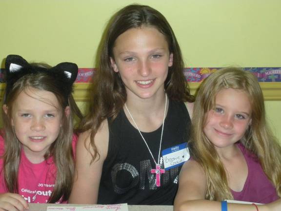 St. Patricks Church hosts Vacation Bible Camp Pictured from left: Ella Vogel, 4th grade Shohola student, Brooke Acoveno, volunteer 6th grade DV student helping making crosses, Shea Stine, 4th grade DV student.