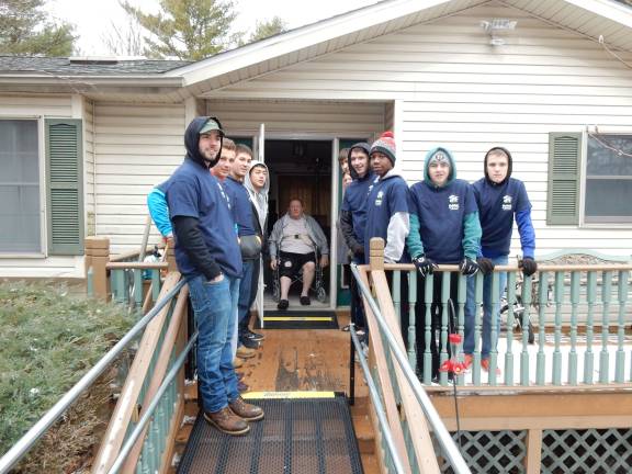 New ramp frees homebound resident Volunteers, including members of the DV basketball team, pitched in to help the Slaters of Pocono Woodlands (Photo provided)