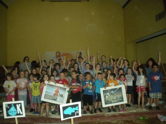 St. Patricks Church hosts Vacation Bible Camp Photos by Mary Caraballo Group picture of campers and helpers.