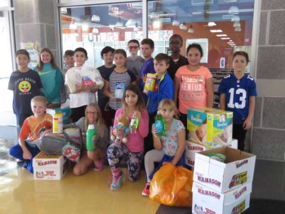Elementary student council collects for hurricane victims Elementary student council collects for hurricane victims
