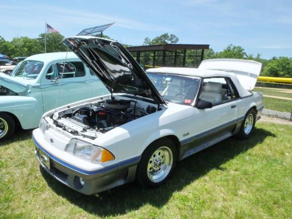 The cars are the stars at 'Cruise in the Park' A Ford Mustang convertible from the 1980s on display