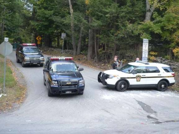 Dispatcher who tried to save trooper sues state police for alleged rape Troopers from New York and Pennsylvania stake out Eric Frein's house in Canadensis during a monthlong manhunt after the September 2014 shooting ambush at the Blooming Grove barracks (Photo by Nathan Mayberg)