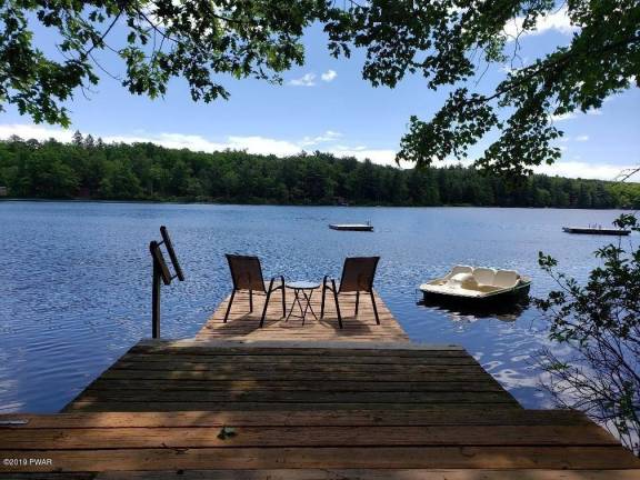 Four-bedroom lakefront contemporary is just steps from beach Dock