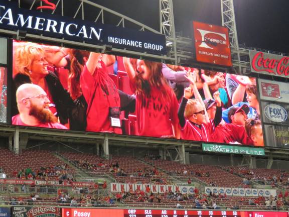 Documentary being produced by DVE-News/TV on inspirational author and playwright Photo provided DV newscasters projected onscreen at the Reds vs. Giants game.