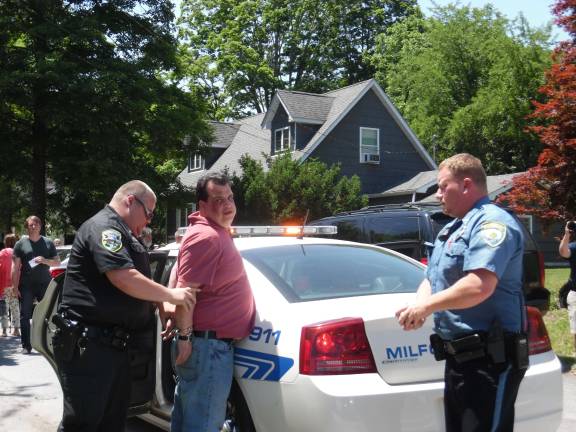 Terror at the farmers market The Milford police arrest Robert Pacella Jr., 45, of Milford, the driver that caused the accidents (Photo by Anya Tikka)