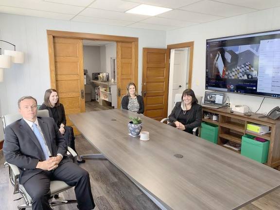 Reception room of The Dickson House, from left: Sarah Wilson, Director of CAC Services; Molly Carson, MDIT Coordinator/Forensic Interviewer; District Attorney Ray Tonkin; and Sara Loeb, Special Victim Interviewer (Photo provided by Sarah Wilson)