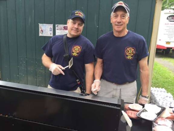 Not alone with Parkinson's anymore Mike Bello and Dave Ruby from the All Volunteer Milford Fire Department cooked hundreds of burgers (Photo by Marilyn Rosenthal)