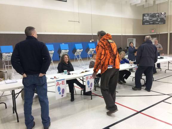 &#x201c;Slow and steady&#x201d; is how poll worker Ann described the voting on Election Day morning at Dingman 1 polling station. (Photo by Linda Fields)