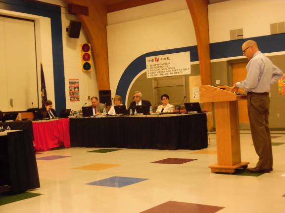 $9 million gym causes debate at DV Don Flynn of Burkavage Design Associates presents the gym contract to the board. (Photo by Anya Tikka)