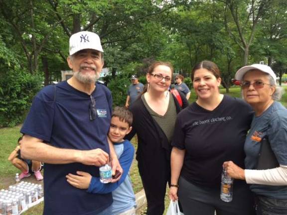 Not alone with Parkinson's anymore Carlos Berrios (left), who has Parkinson’s, proudly completed the one mile walk. His support team is by his side. (Photo by Marilyn Rosenthal)