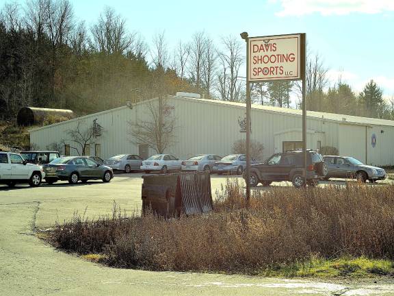 After shooting, a rush to buy guns Several cars parked outside Davis Shooting Sports in Goshen, where customers flocked to make gun purchases following a the fatal shooting of 20 children in Newtown, Conn. (Photo by Joshua Rosenau)