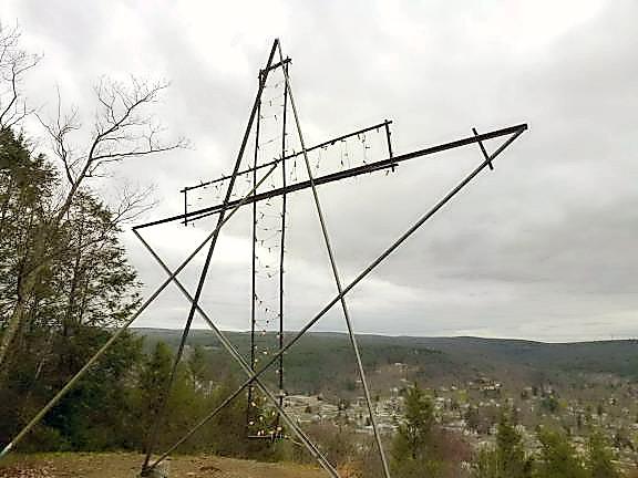 The ornament on the Milford Knob, now gone, could be strung with lights to make a cross for Easter, as shown, or to make a Christmas star