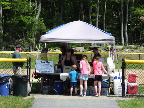 The cars are the stars at 'Cruise in the Park' The barbecue table of the Delaware Football League was kept busy