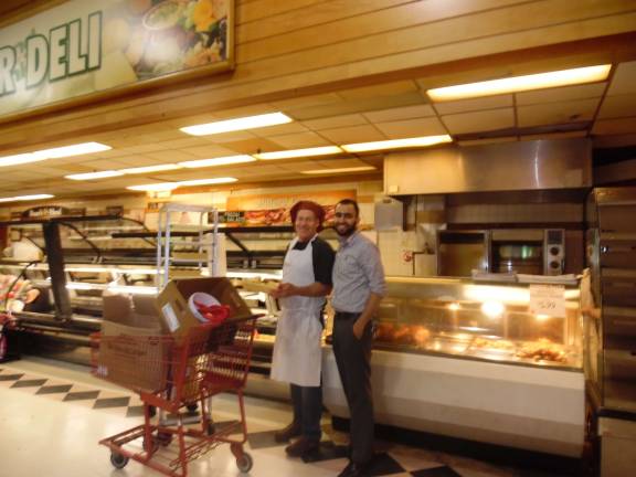 New supermarket owner cleans up Junior Dabashi with deli manager Len Loeb (Photo by Anya Tikka)