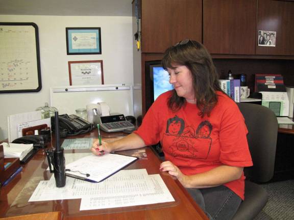 Karen Quick's July 30 closing announcement letter Karen Quick at her desk at the Milford Learning Center