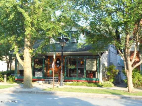 Two-story building with apartment and successful business Two-story building with apartment and successful business